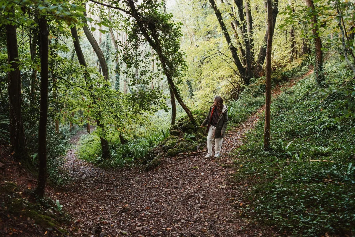 Woman walking in woods
