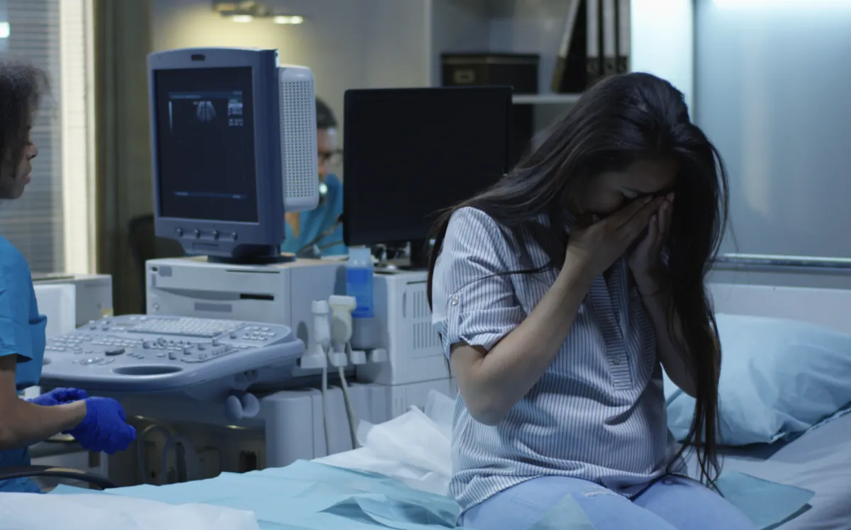 Woman Crying in Hospital