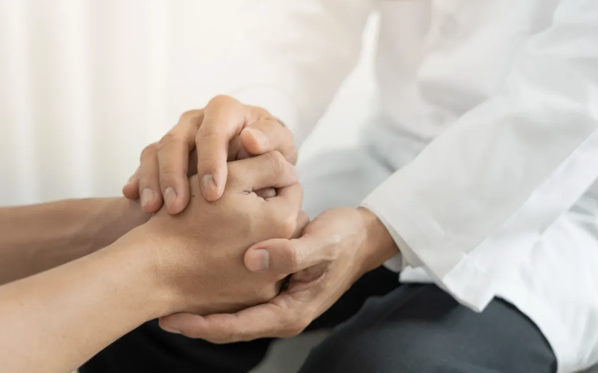 Doctor and Patient Holding Hands