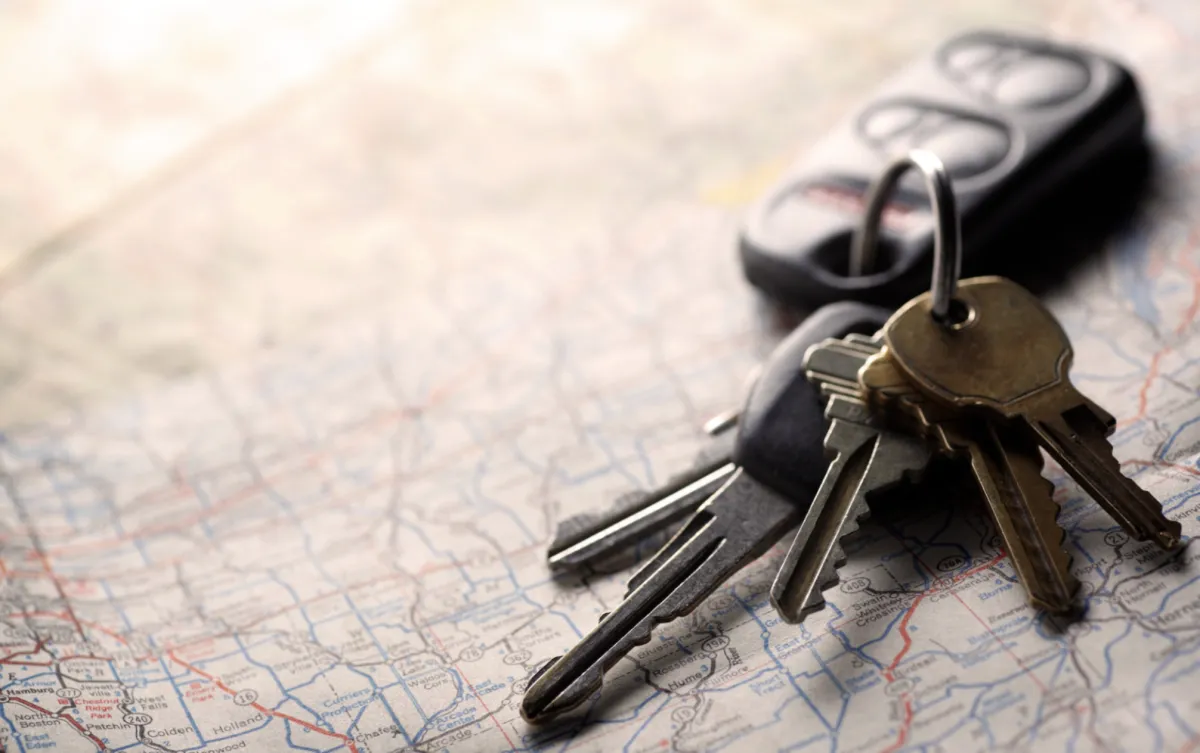 Planning travel with map and keys