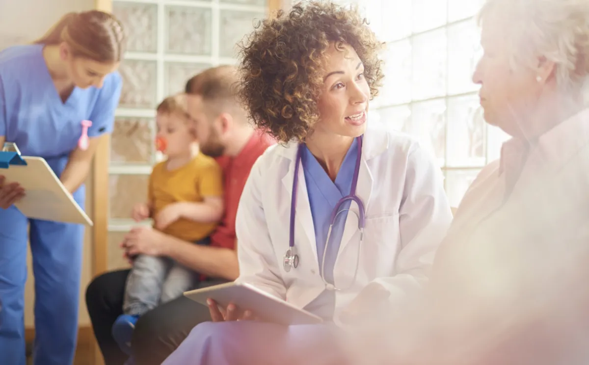 Doctor discussing Scrambler Therapy with Patient in waiting room