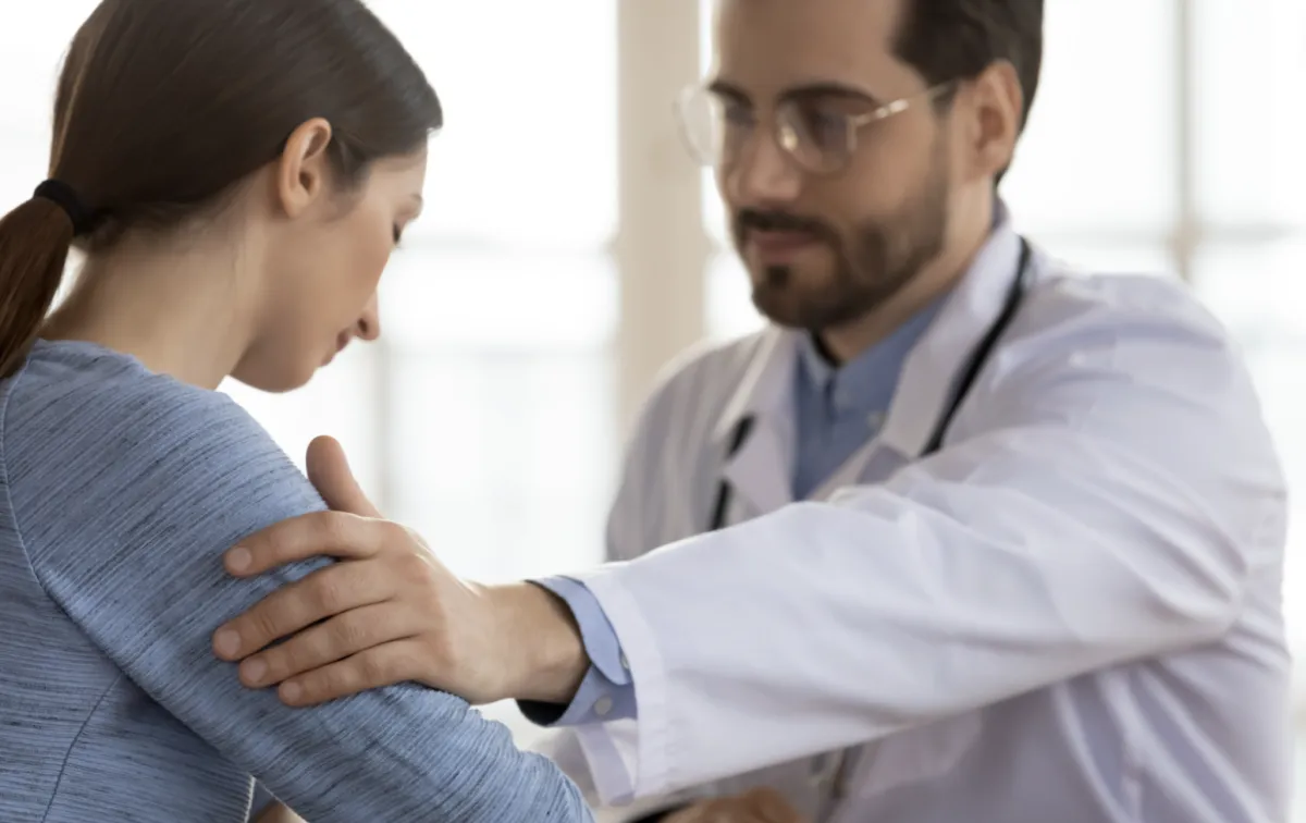 Doctor having a caring discussion with patient