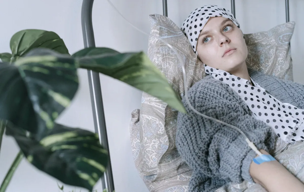 Cancer patient lying in bed