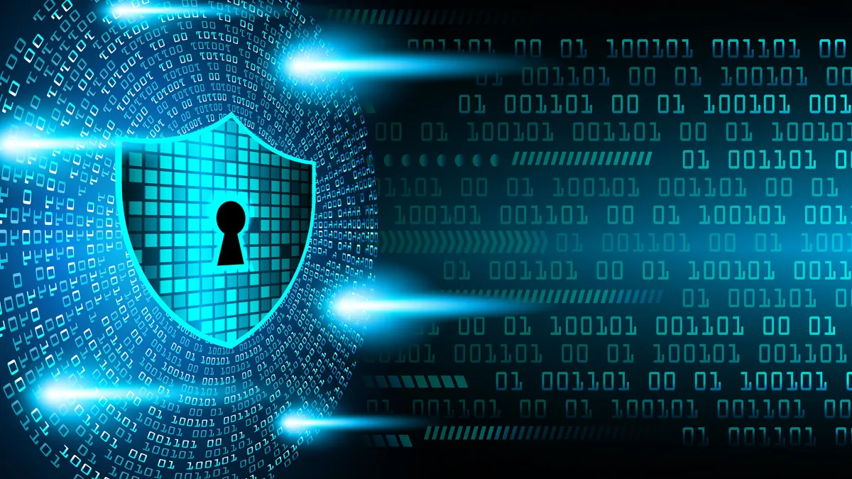 Blue digital shield with keyhole symbol surrounded by binary code, representing cybersecurity, data protection, and small business privacy in 2025.