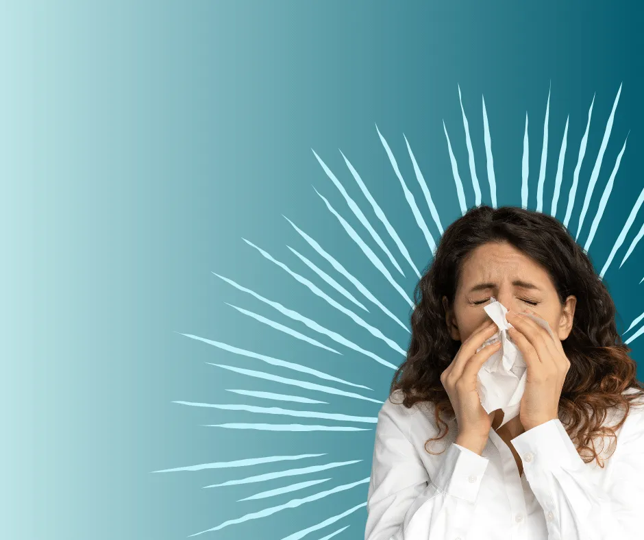 woman sneezing because of allergies