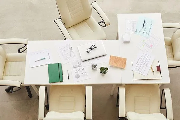 Top-view flat lay of a table filled with documents, symbolizing PhilHealth updates and compliance planning for SMEs in 2025