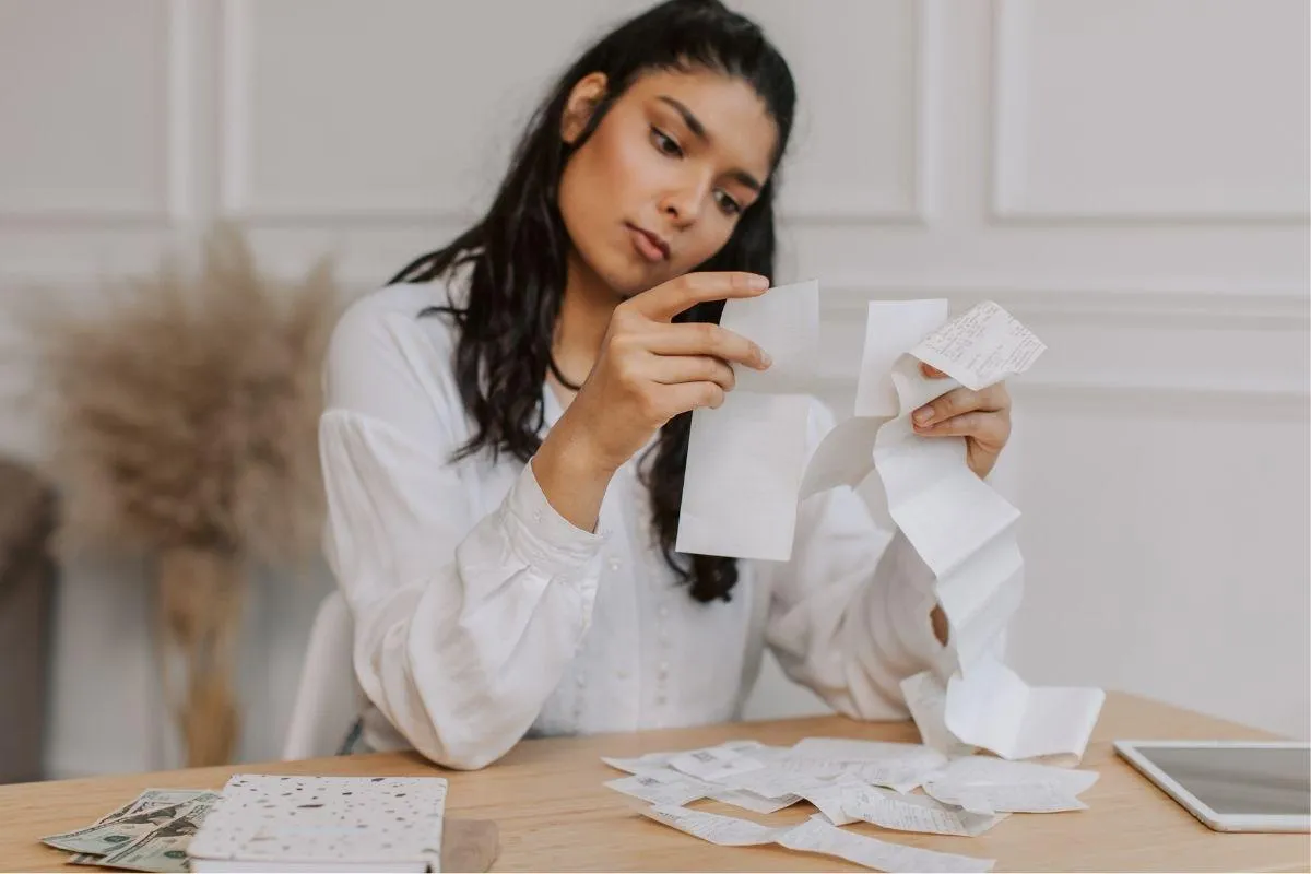 Woman looking at reciepts and P&L