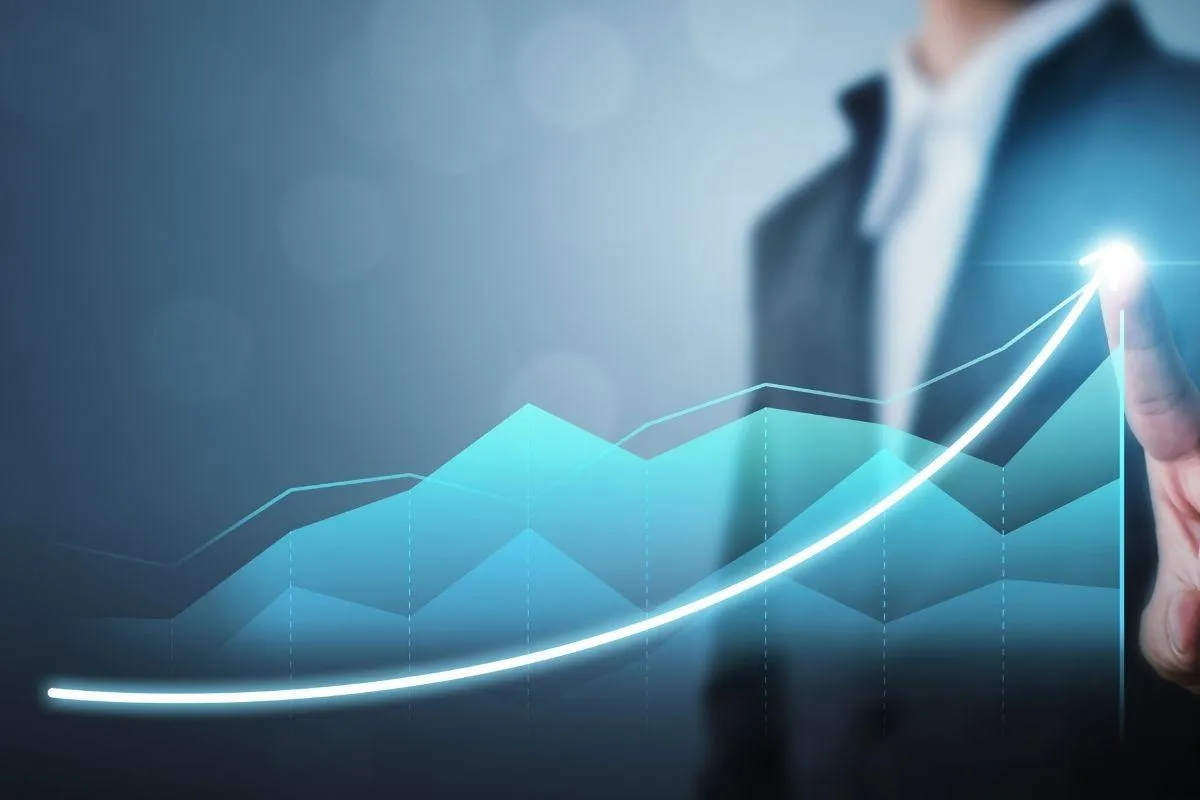 Arrow moving up to indicate business growth with a man at the end