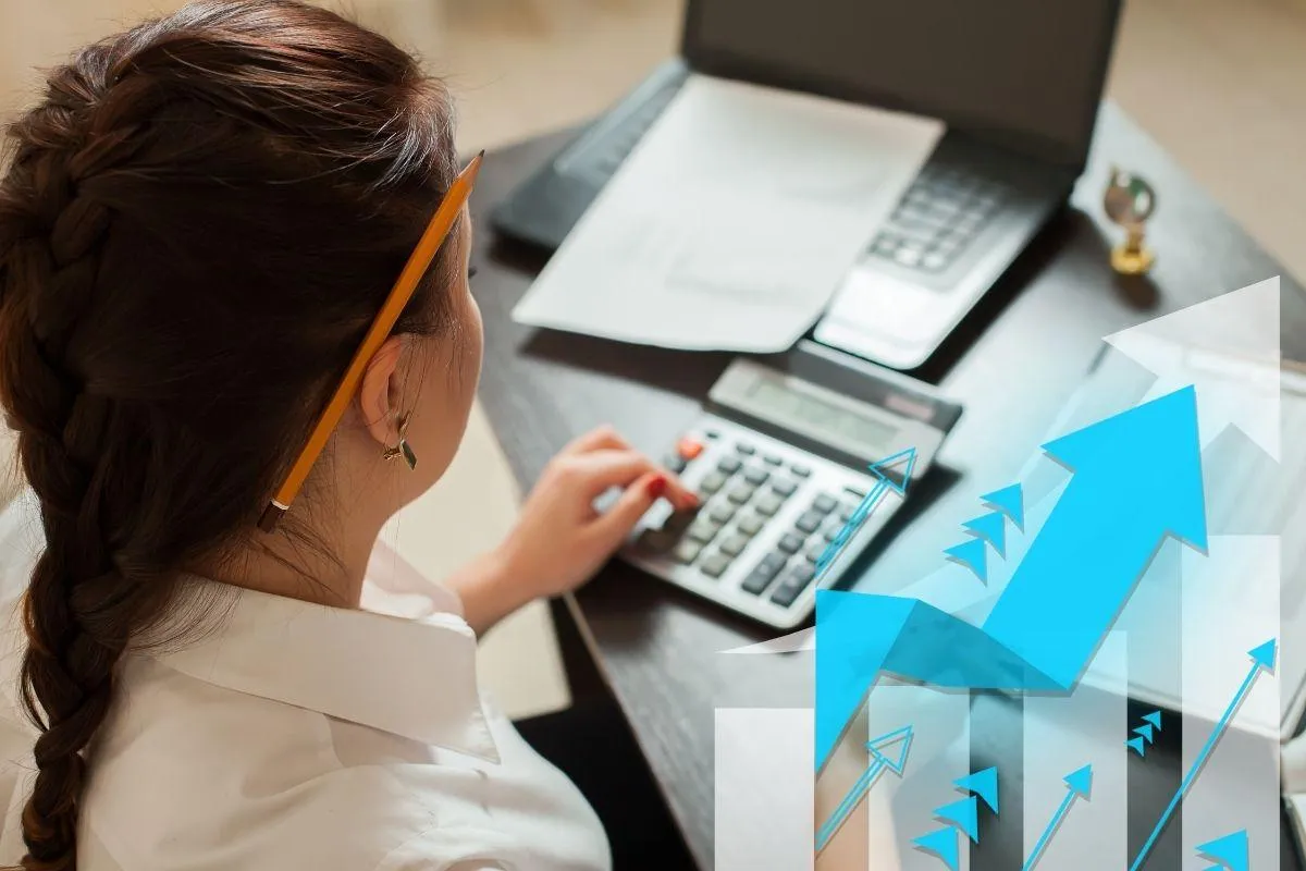 Bookkeeper and chart showing business growth