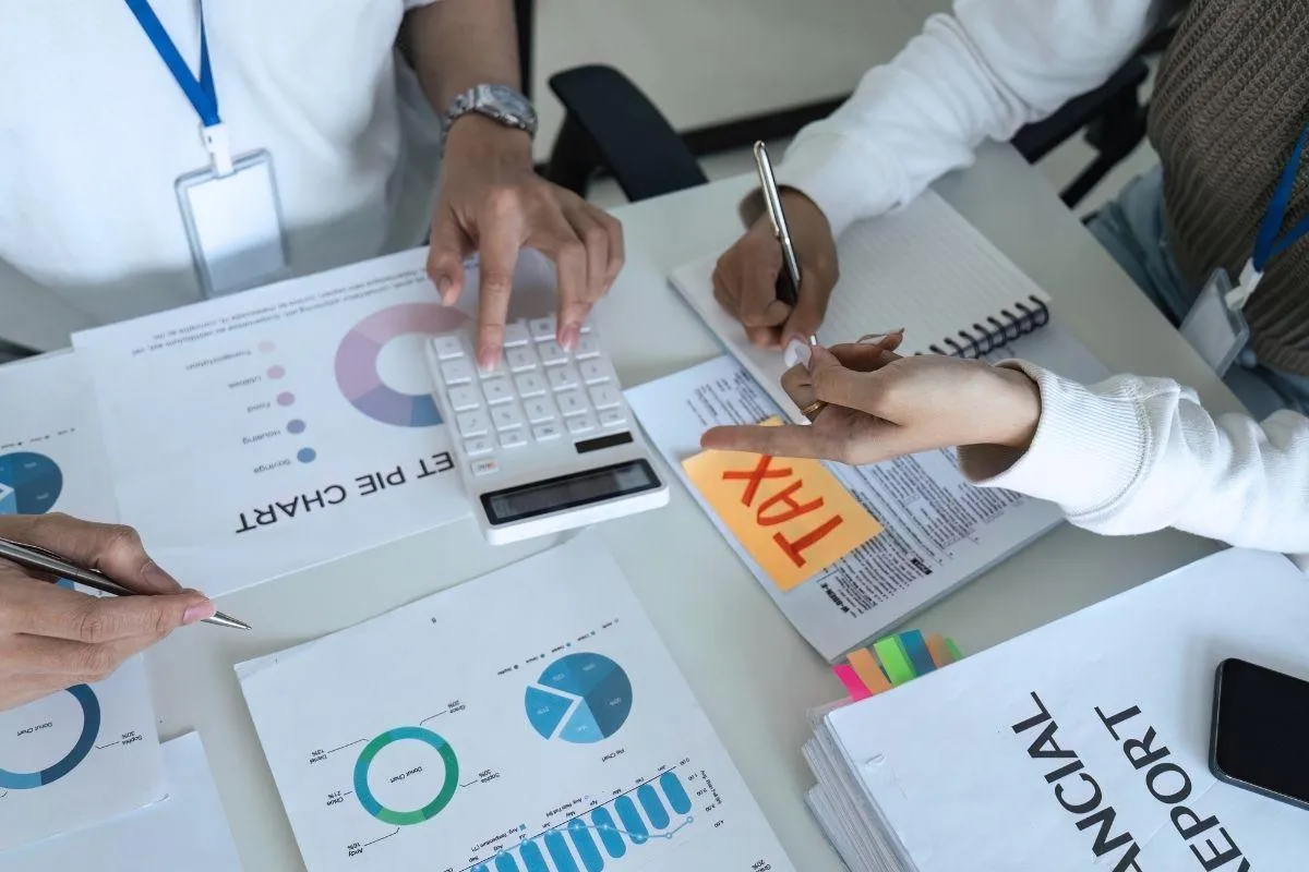 Tax documents spread out on table to look for deductions