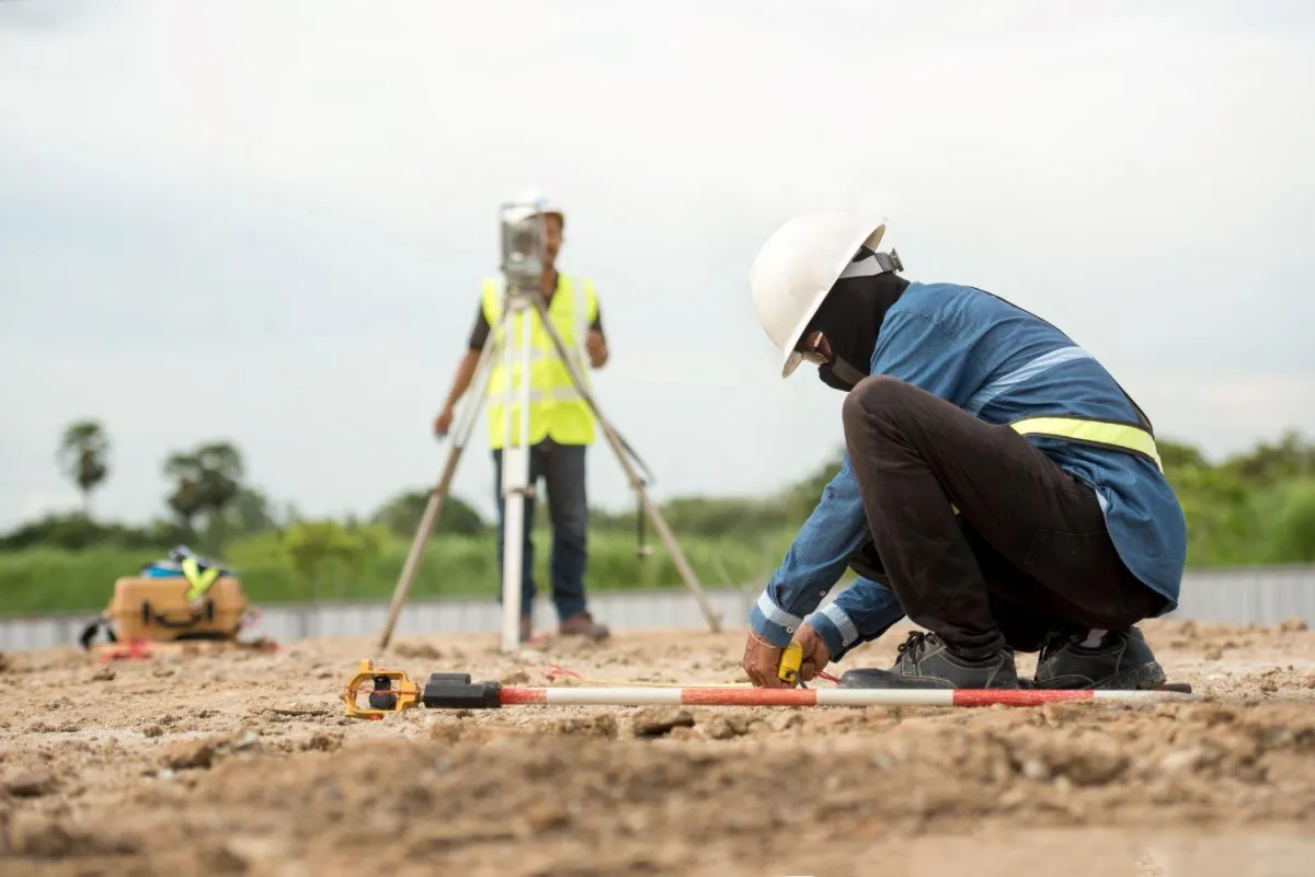 Land Surveyors Working