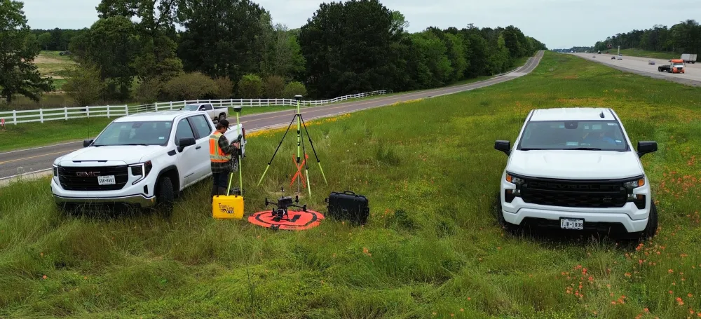 Land Surveyor by a Truck