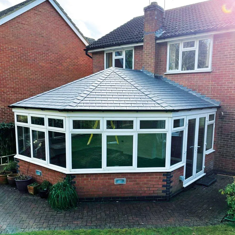 A stylish octagonal conservatory with a newly installed warm roof system, providing superior insulation and a sleek modern aesthetic.