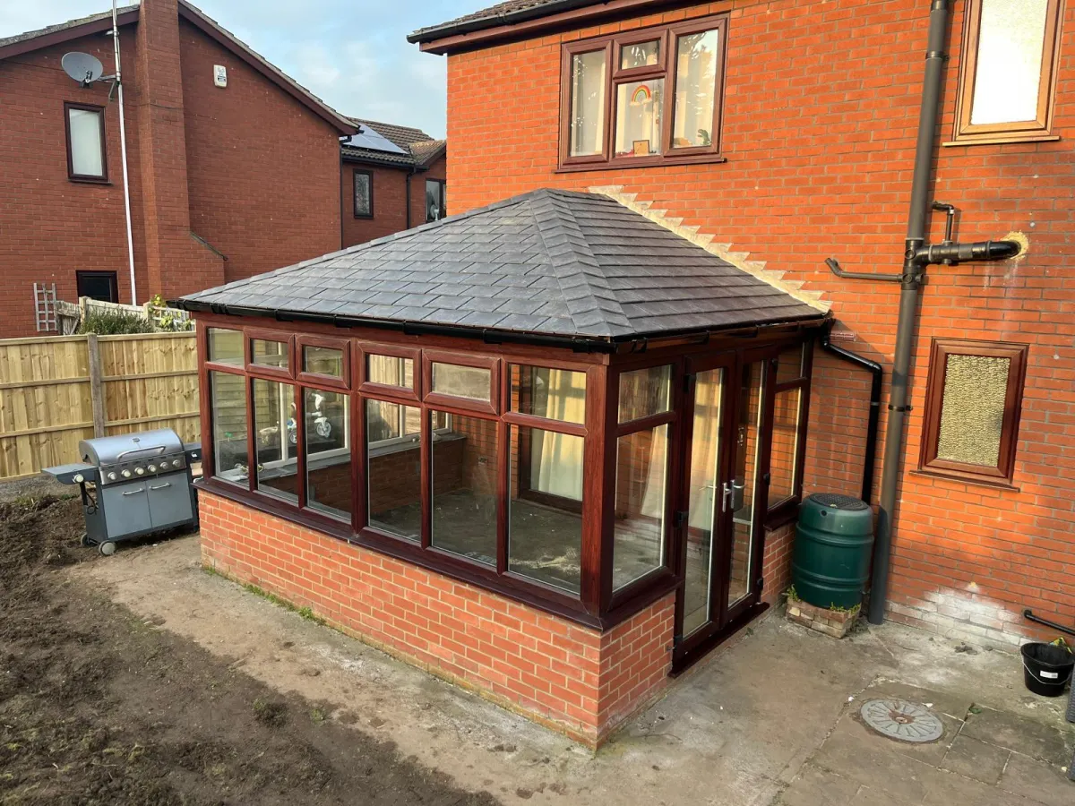 A beautifully finished timber-frame conservatory with a new tiled roof, offering enhanced insulation and a stylish, traditional look.