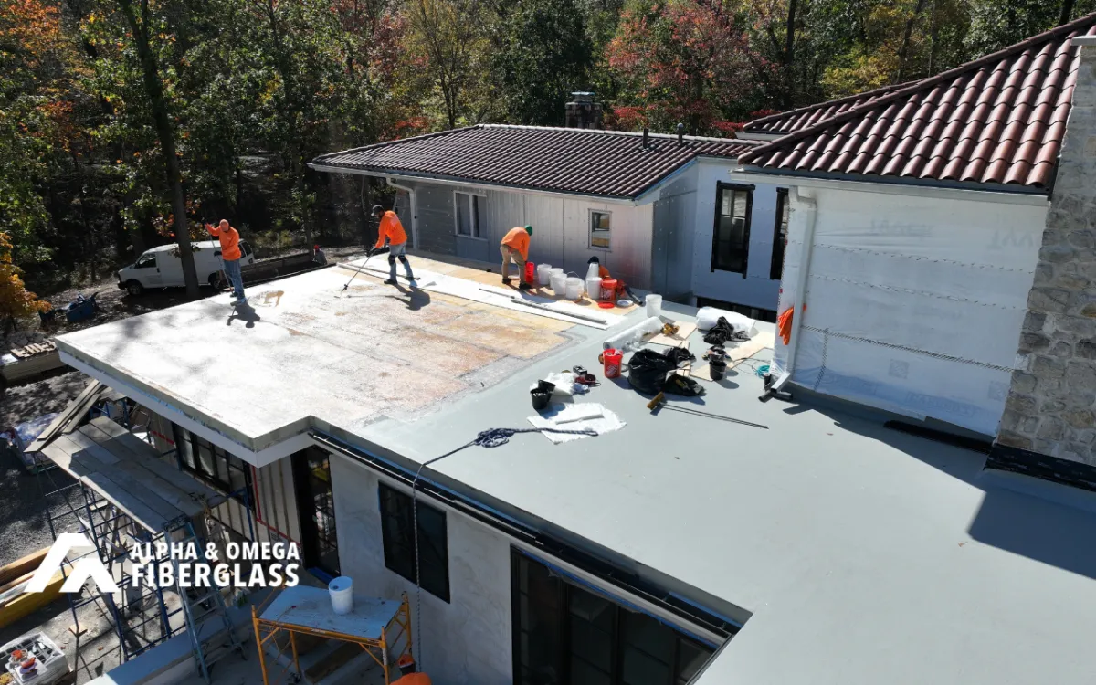 Fiberglass roof repair service near me inspection on a flat roof