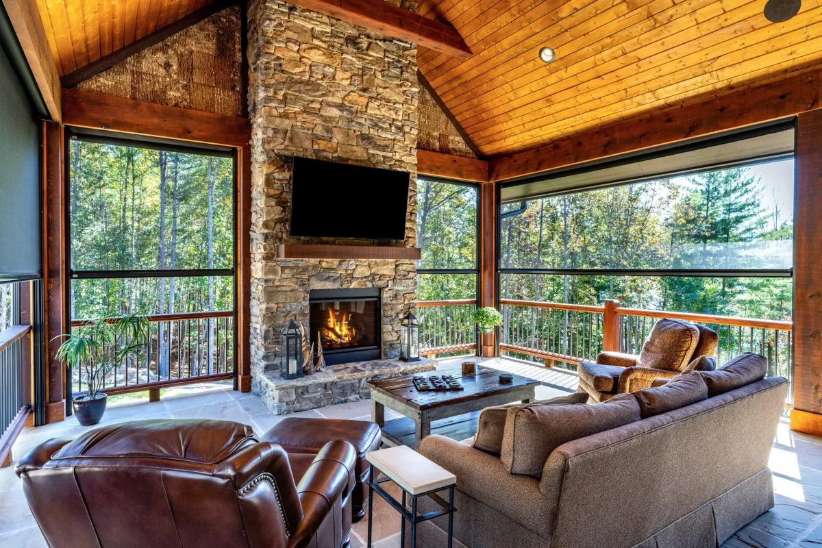 An Outdoor dining room featuring a ceiling fan and a view of a serene pool outside, creating a relaxing atmosphere. MagnaTrack