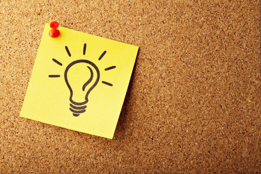 lightbulb on a sticky note