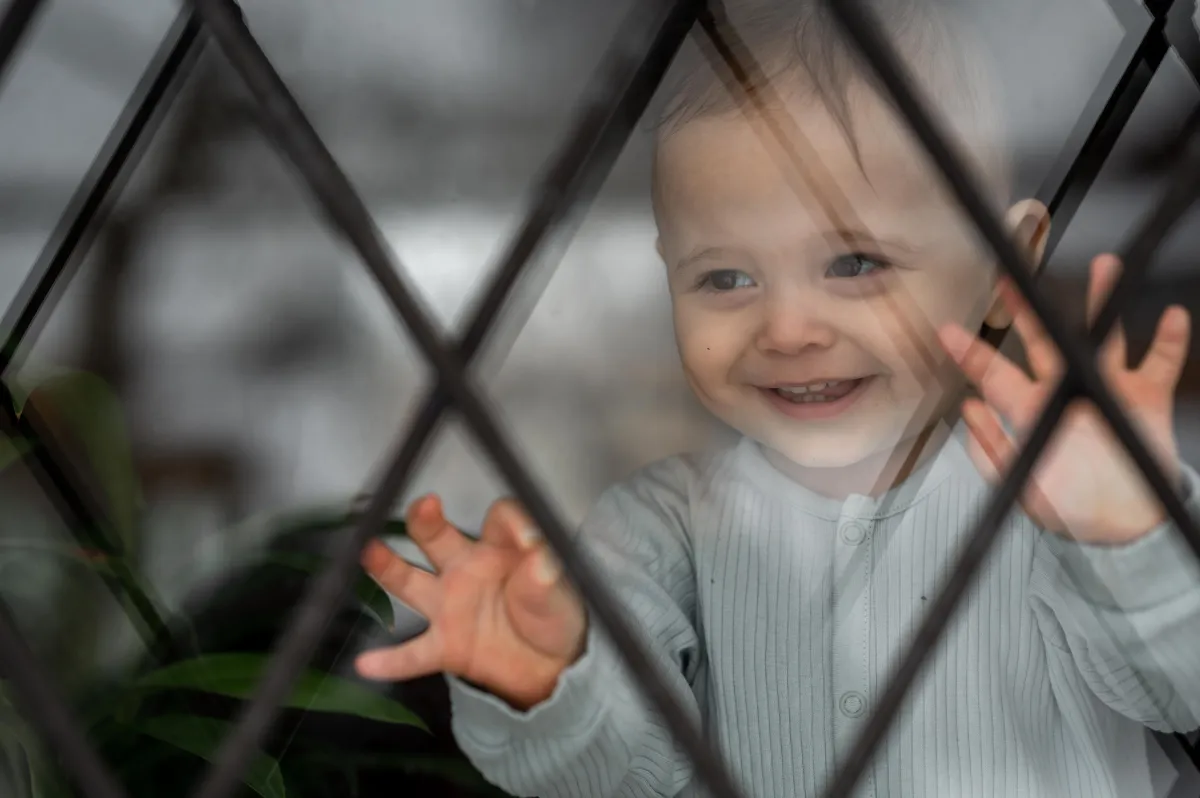 An image of a child who is safe and happy at home, the result of the work Jesus Aragon has done with identy.io. 