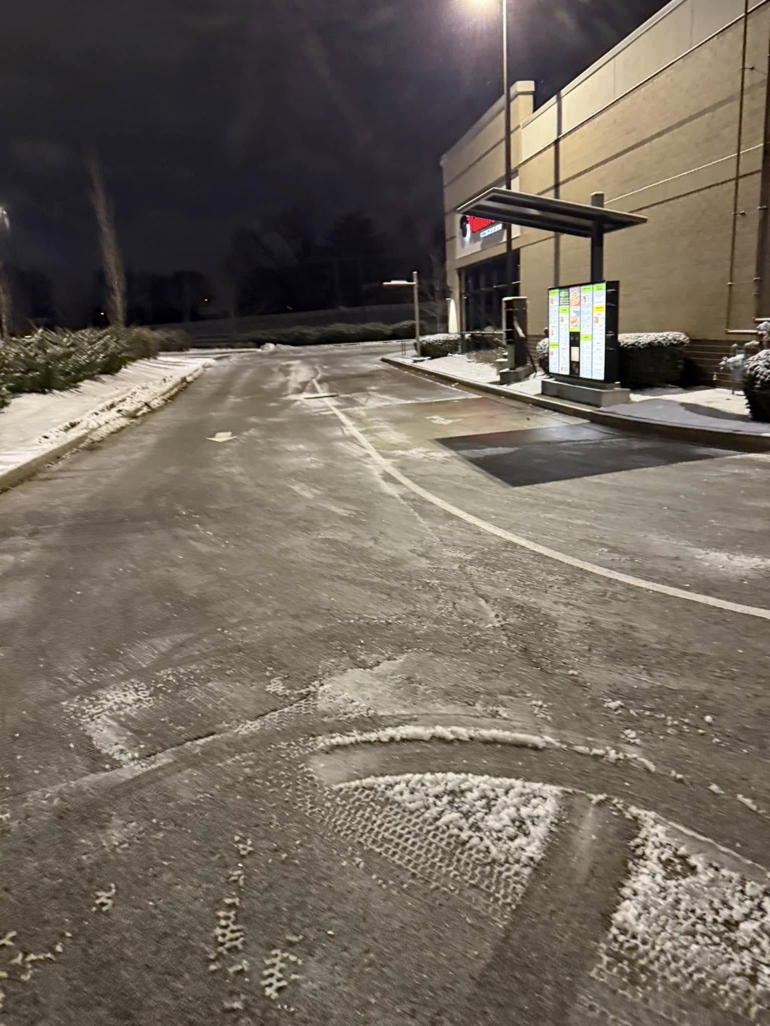 Snow plow clearing commercial parking lot Spring Hill Tennessee portfolio