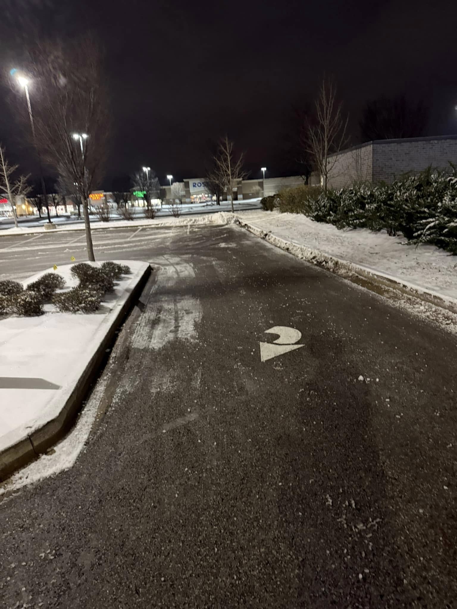 Snow plow clearing commercial parking lot Spring Hill Tennessee portfolio