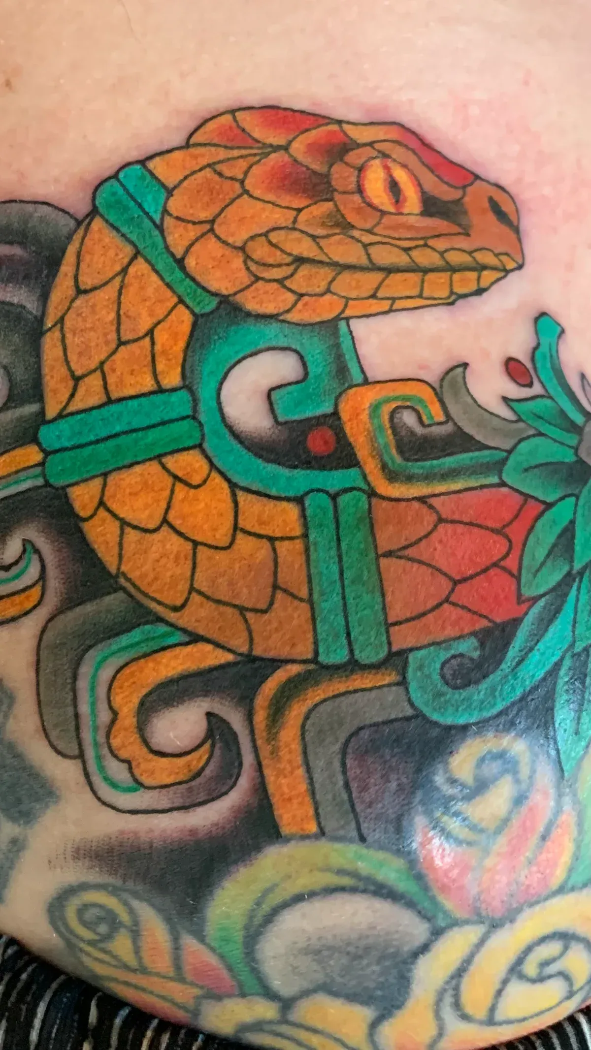 the golden serpent tattoo: Professional tattoo by Nicole Miller at Montana Tattoo Company in Missoula, MT