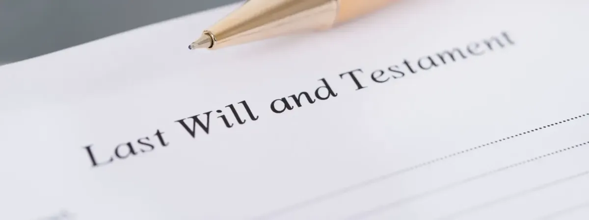 Close-up of a pen resting on a Last Will and Testament document, symbolizing the importance of estate planning and avoiding intestate succession in West Virginia.