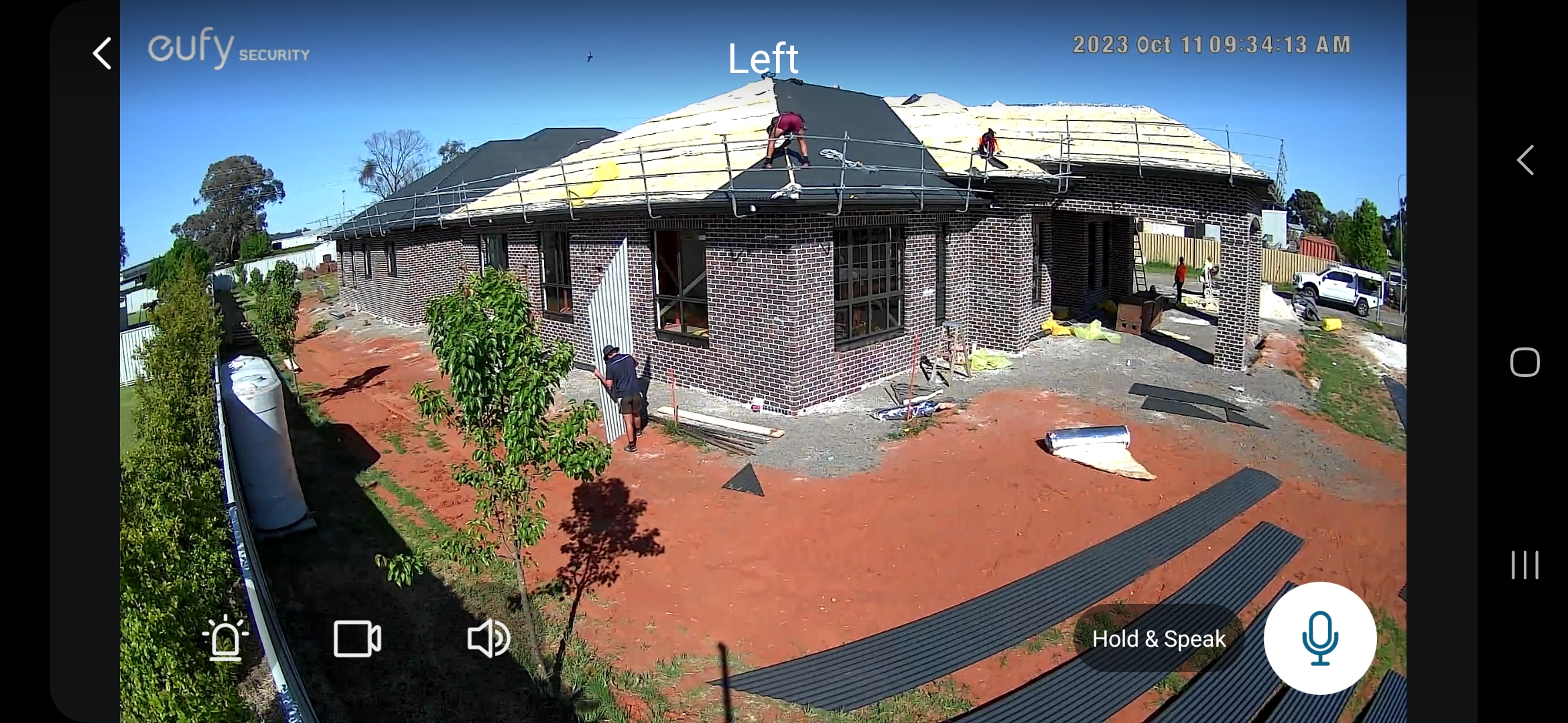 Experienced metal roof plumbers installing Colorbond roofing and flashings on a residential house in regional Australia, using safety guardrails and professional tools.