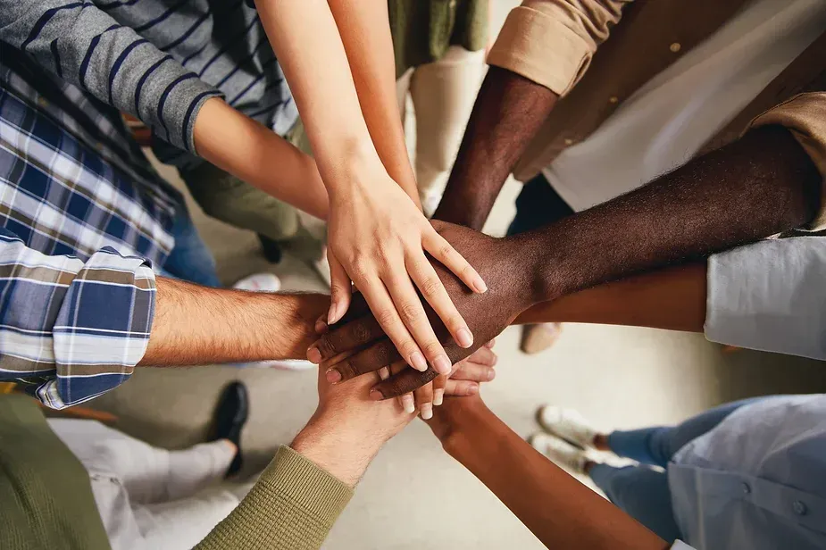 Multiple arms united in solidarity
