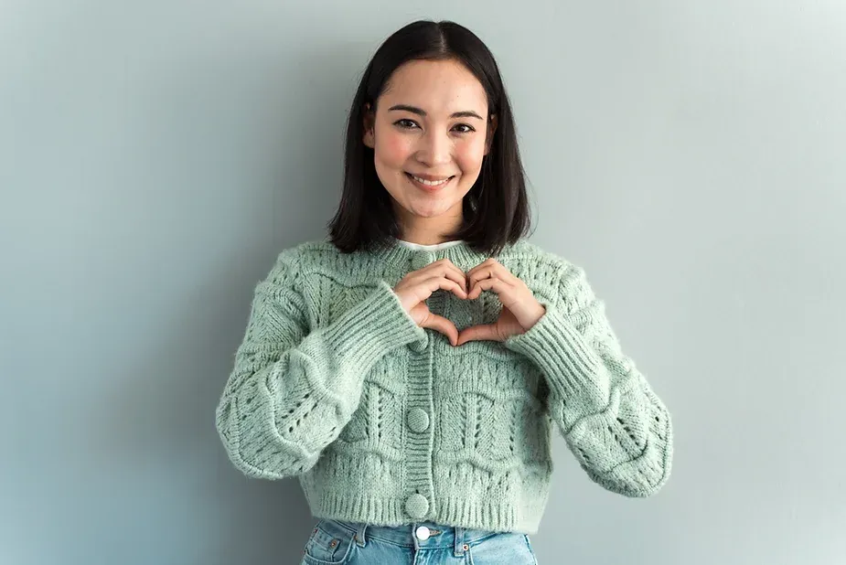 Woman making a heart shape