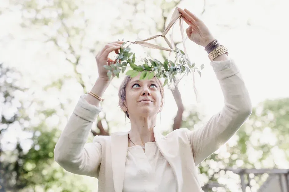 Woman hanging a garland 