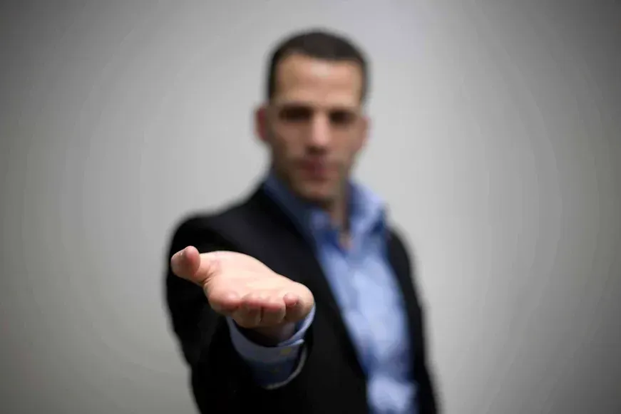 Man with hand extended