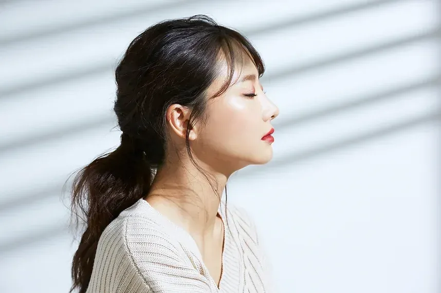 Beautiful Asian woman with eyes closed