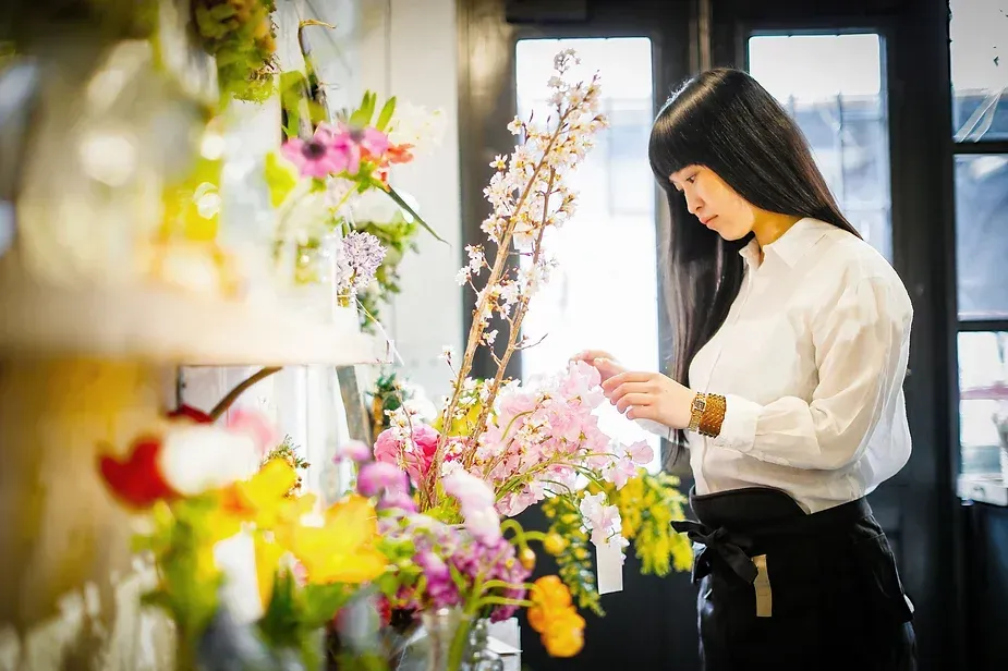 Woman with flower arrangement