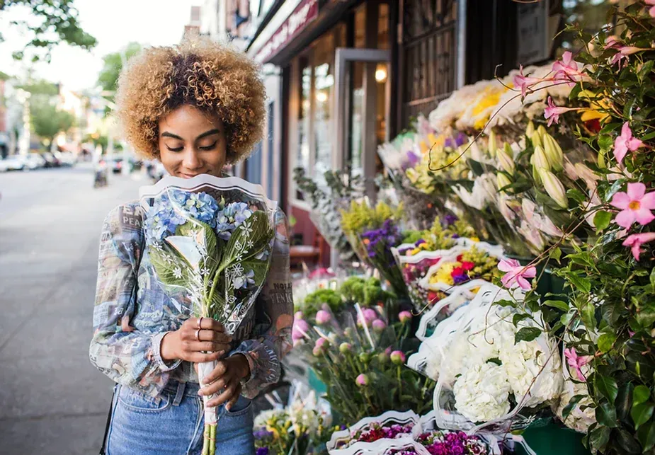 Woman at flower stand