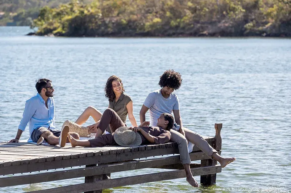 Friends sitting on a dock