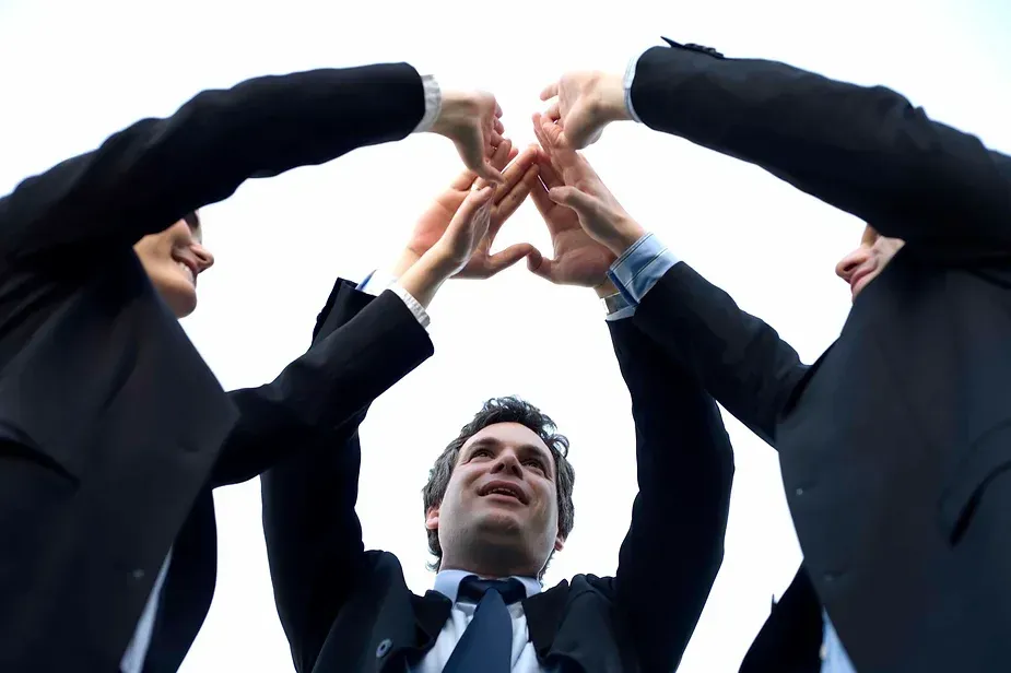 Men giving high 5's