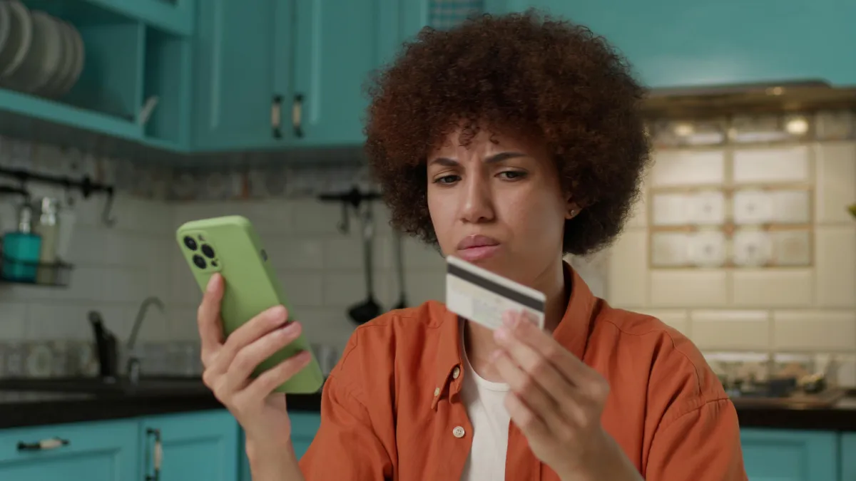 Confident minority women wellness practitioners smiling in a bright studio, holding laptops and yoga mats, symbolizing the CEO Shift from hobby to thriving business.