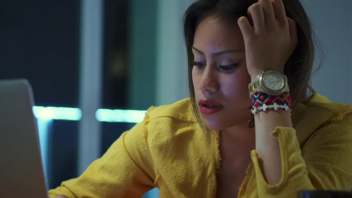 Empowered minority women wellness professional smiling with a tablet in a bright studio, meeting with a focused client