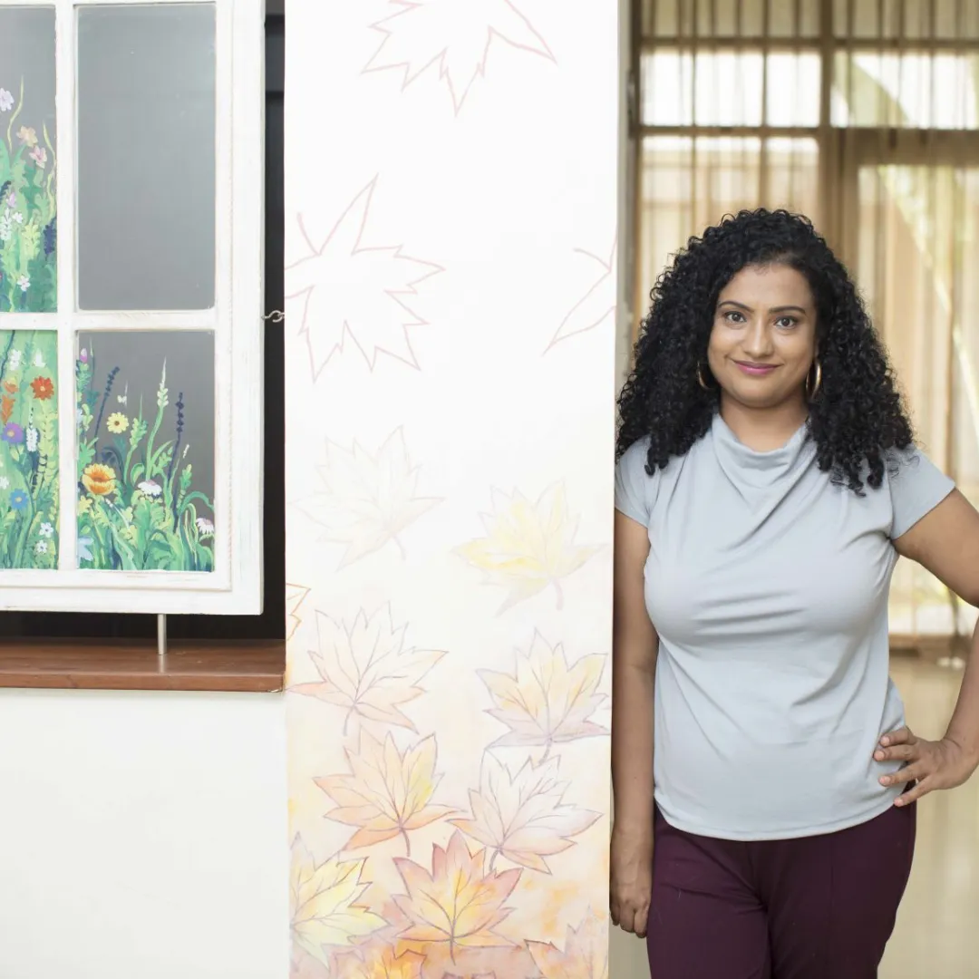 South Asian mother practicing nervous system regulation while connecting with her child"