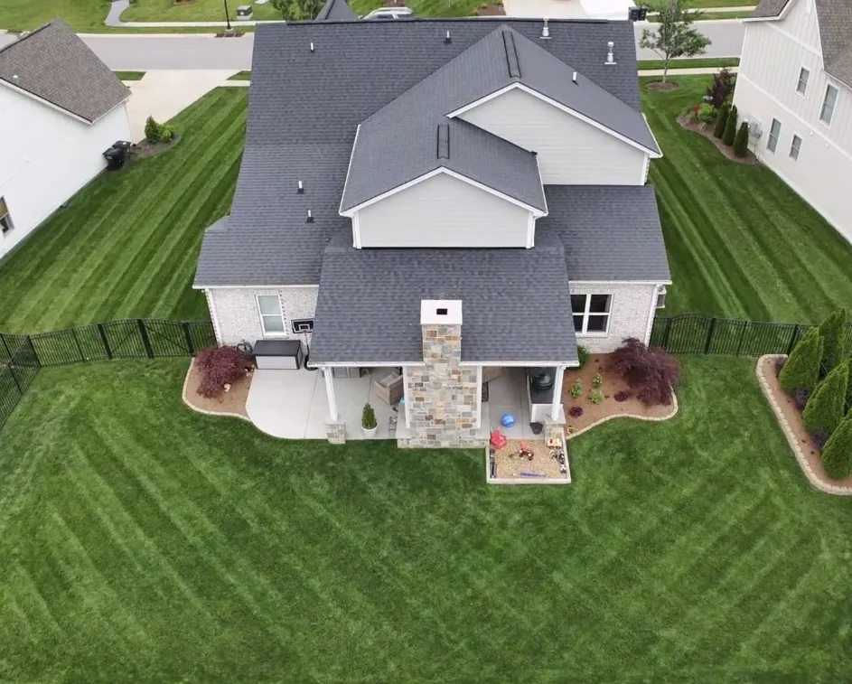 arial photo of home in tennessee with large, green backyard