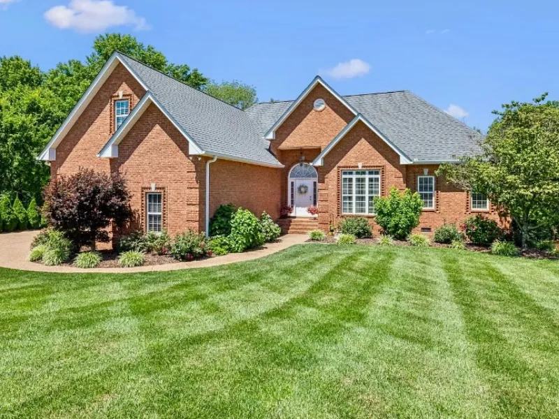 home in tennessee with large, green front yard
