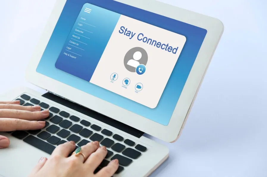 Person using a laptop with 'Stay Connected' screen, showcasing pay-per-call communication features