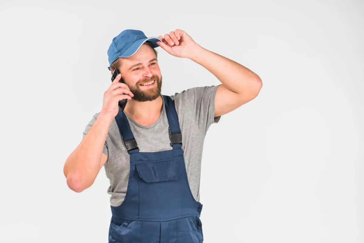 home services worker taking a call, representing pay-per-call success for home services companies