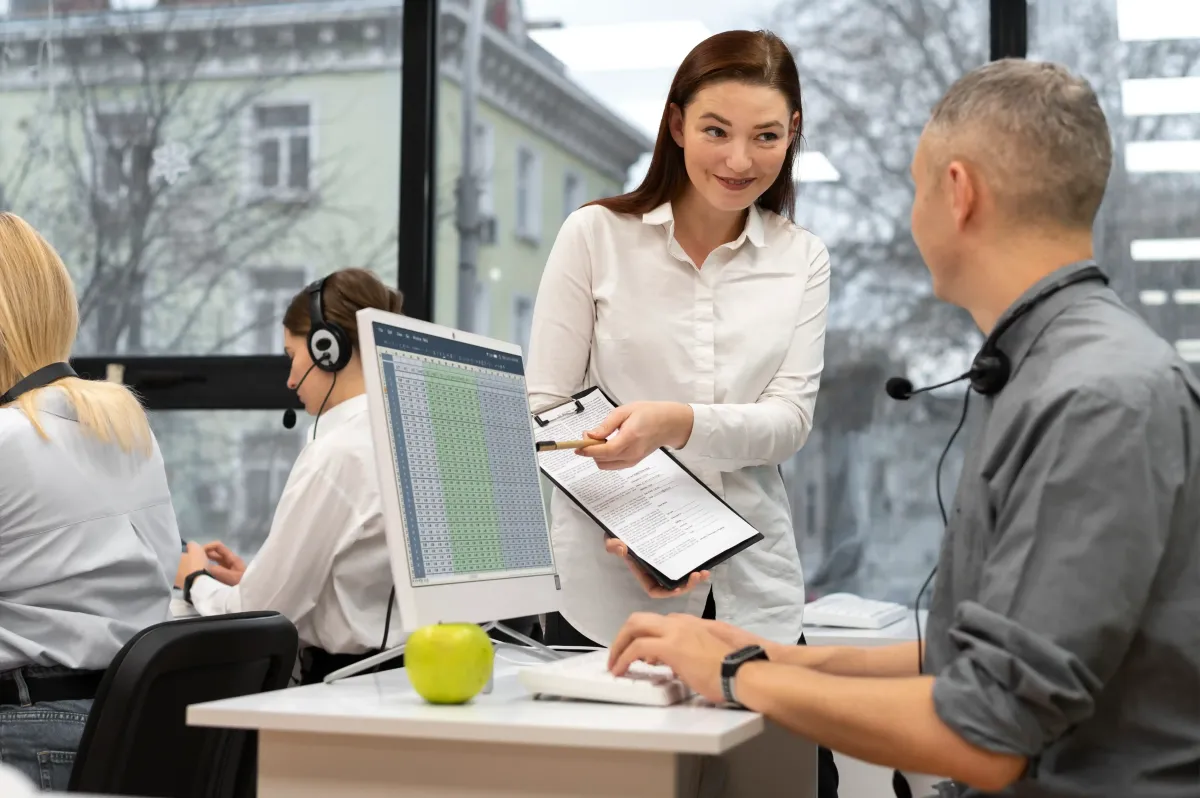 two people working with pay per call tracking software