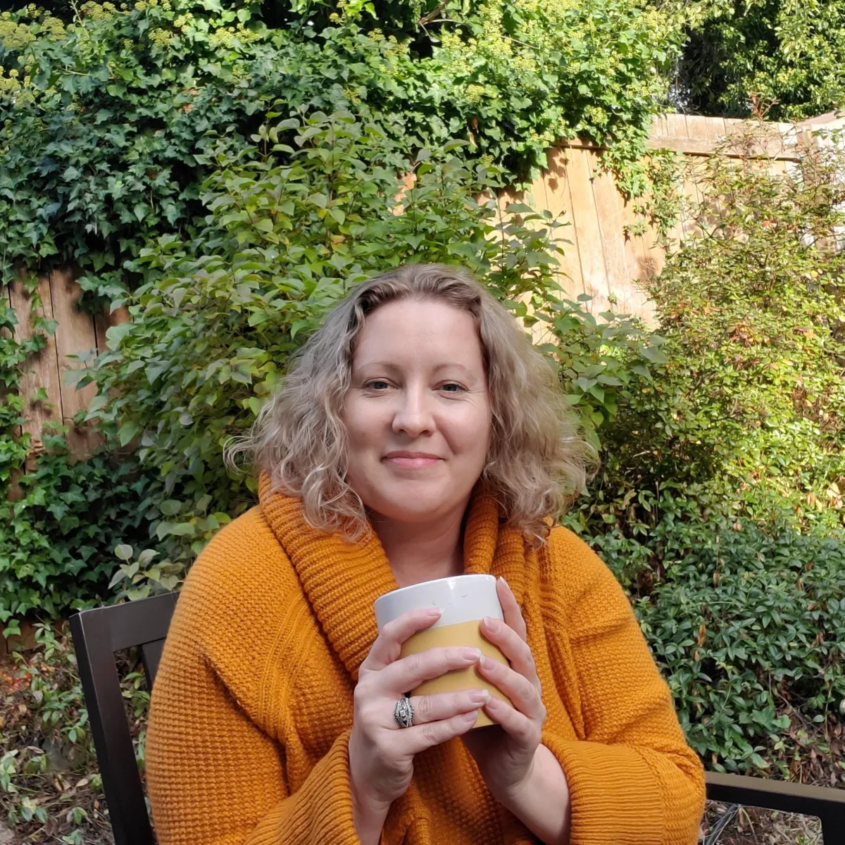 Margo outside with her cuppa morning coffee