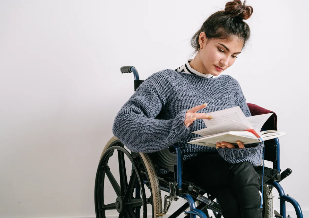 Job coach teaching job readiness skills to a young adult with a disability