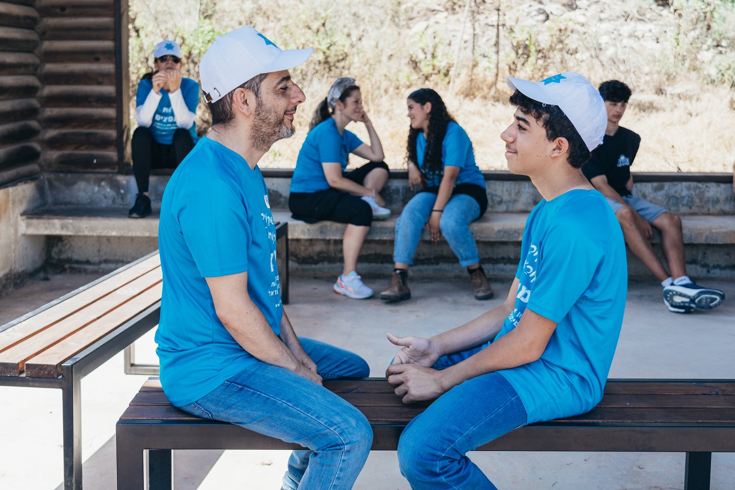 An adult encouraging a child.
