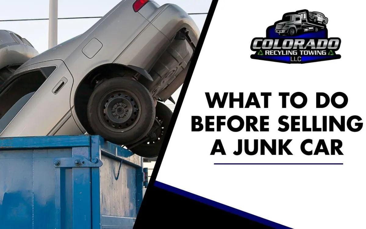 Person removing belongings from a junk car