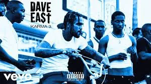 Cover Image for the "Handsome (Remix)" Single - Dave East sits on a bike