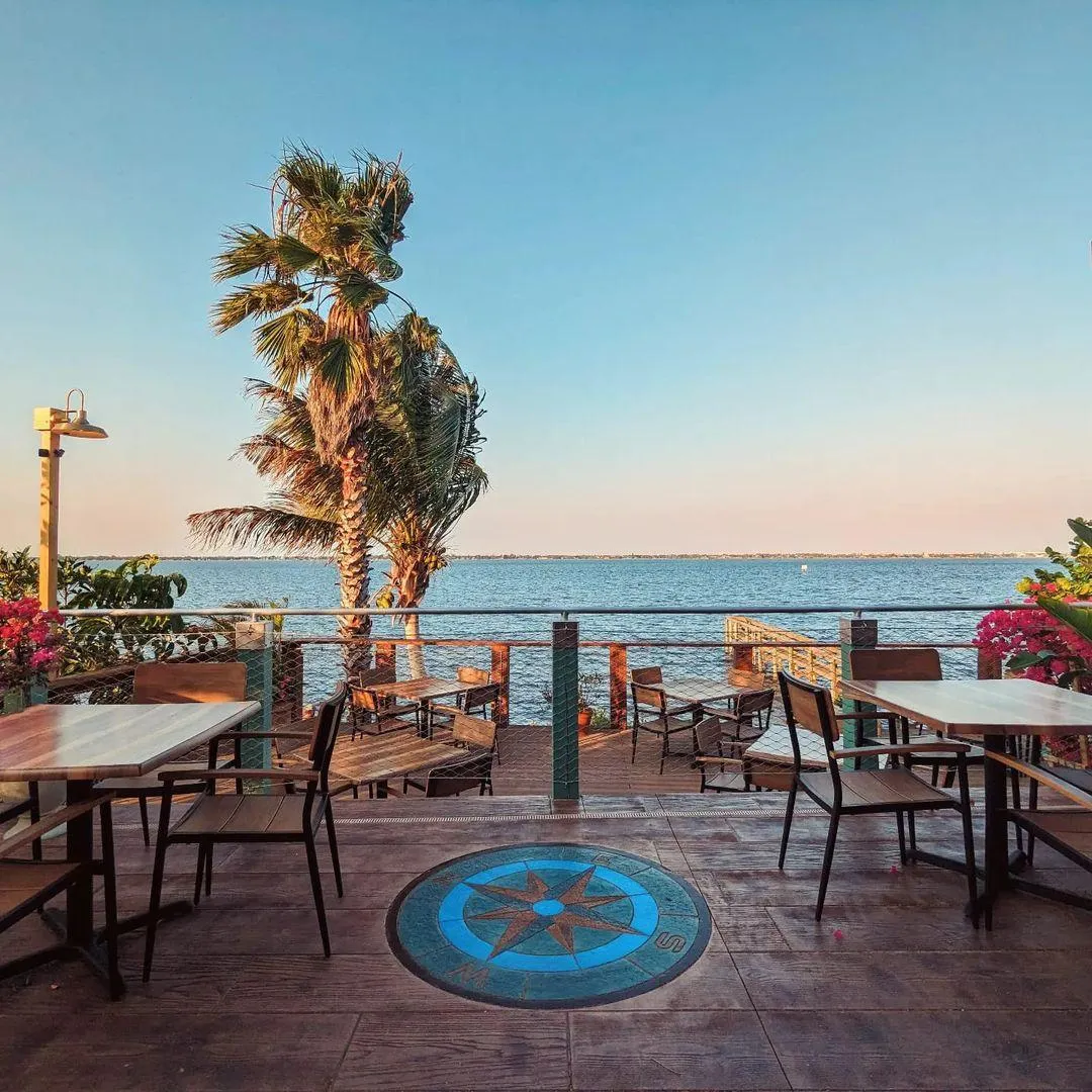 The Brevardian Riverfront’s elegant logo sign at the restaurant’s entrance, combining vintage-inspired typography with a modern coastal aesthetic.